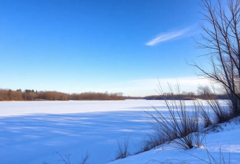 A scenic view of a frozen lake in cold weather