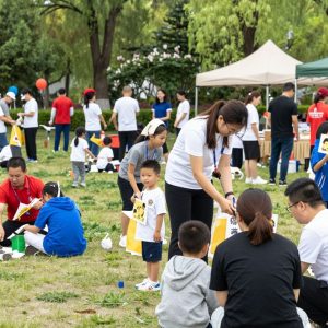 Community gathering at Irmo charity event with families and children.