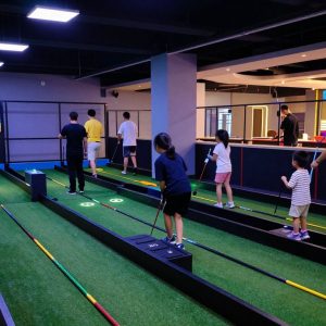 Families enjoying indoor mini golf in Columbia SC