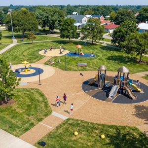 Aerial view of a revitalized park in Irmo with families enjoying the green spaces.