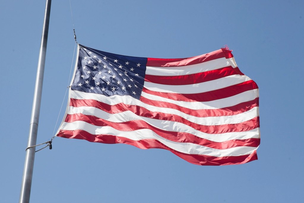 U.S. flag on a pole against clear sky