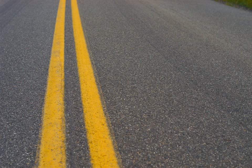 Empty two-lane road with painted center line