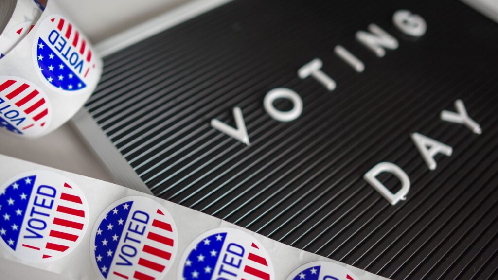 Voting Day letter board with I Voted stickers